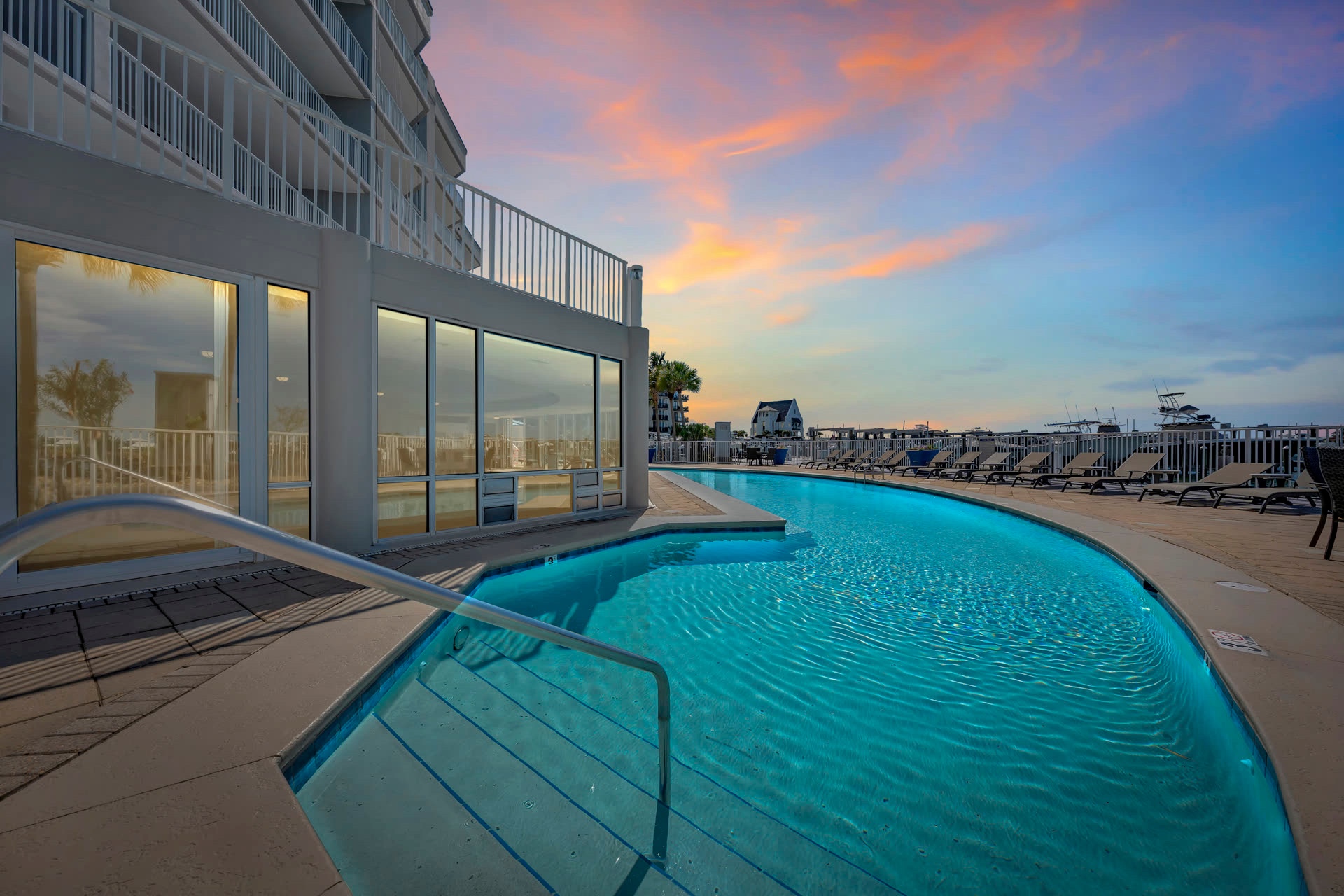 Infinity pool meeting the ocean at golden hour