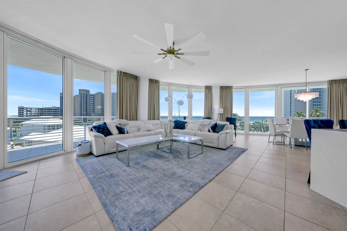 Living room with floor-to-ceiling windows and coastal views